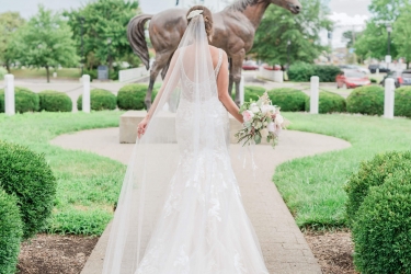 Bride in dress outside the hotel