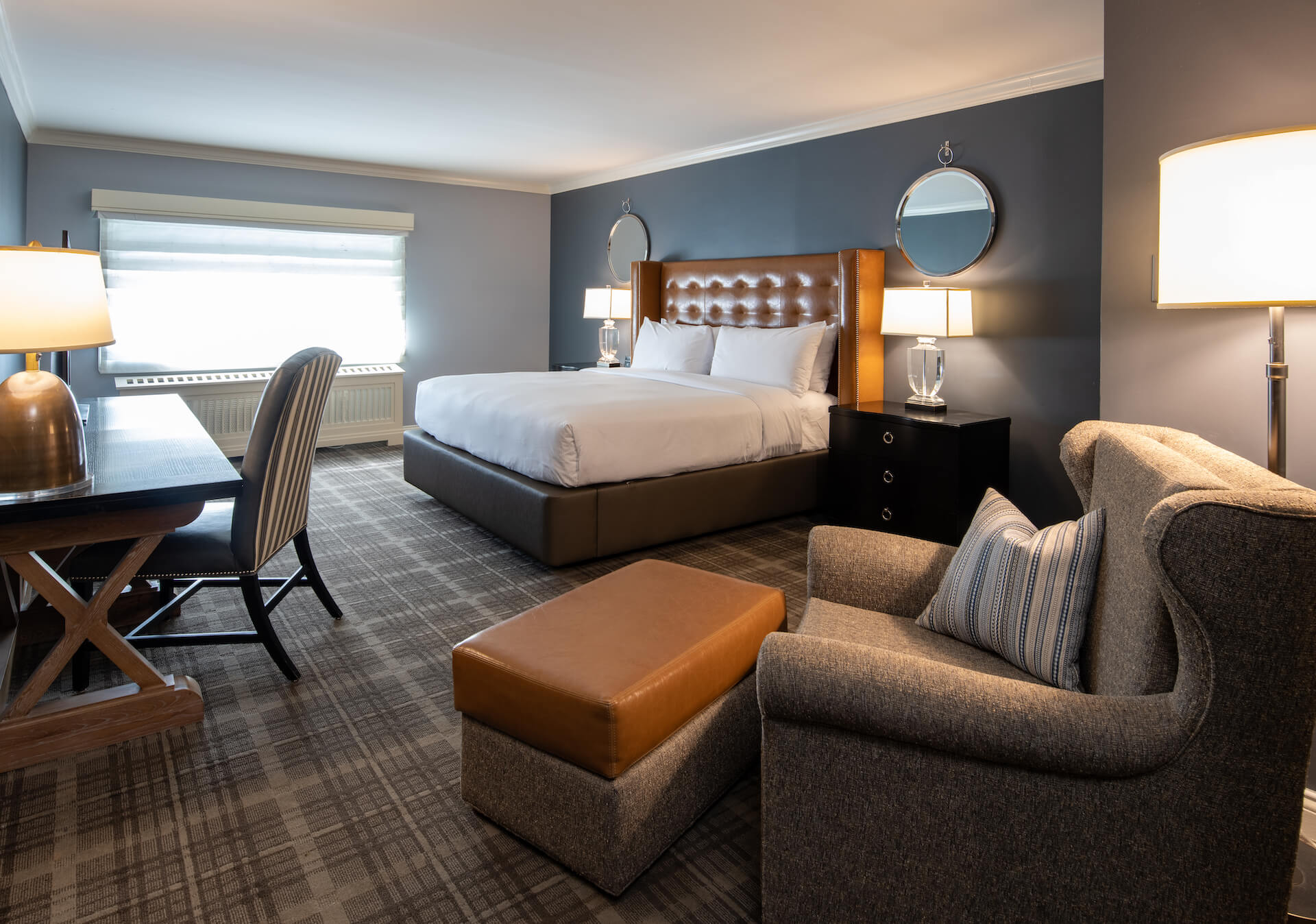 Large bedroom with desk and sitting area