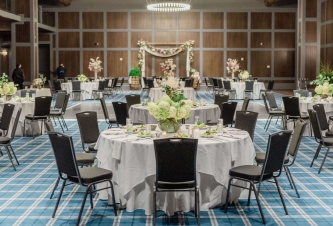 Wedding tables set up in ballroom